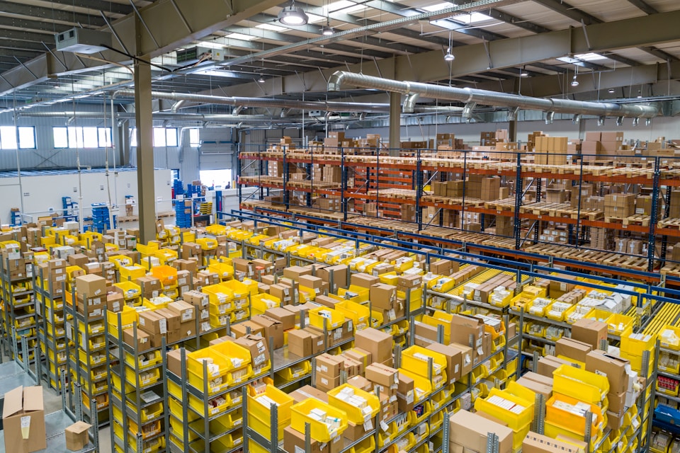 Distribution warehouse with stacked FMCG cartons